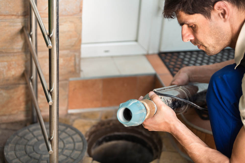 technician preparing hydro jetting equipment