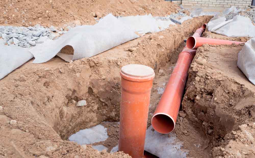 excavated area showing damaged sewer line Seattle, WA