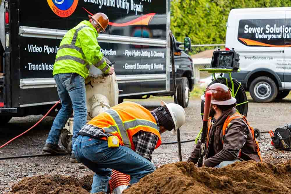 technicians excavating underground sewer line Bellevue, WA