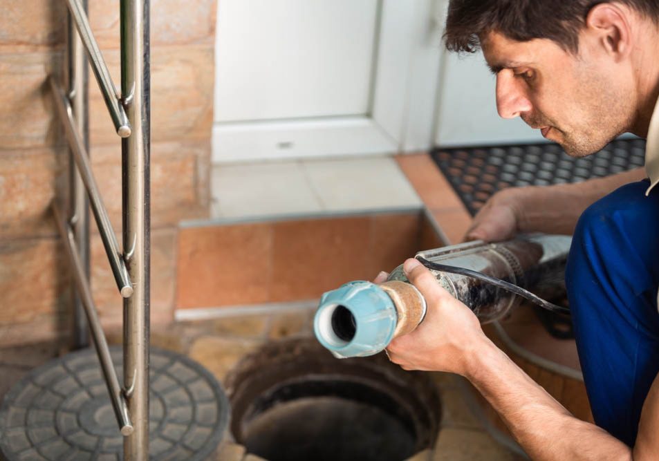 technician preparing hydro jetting equipment