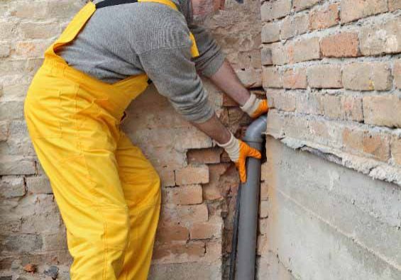 a plumber repairing the pipes