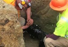 technicians performing trenchless pipe replacement